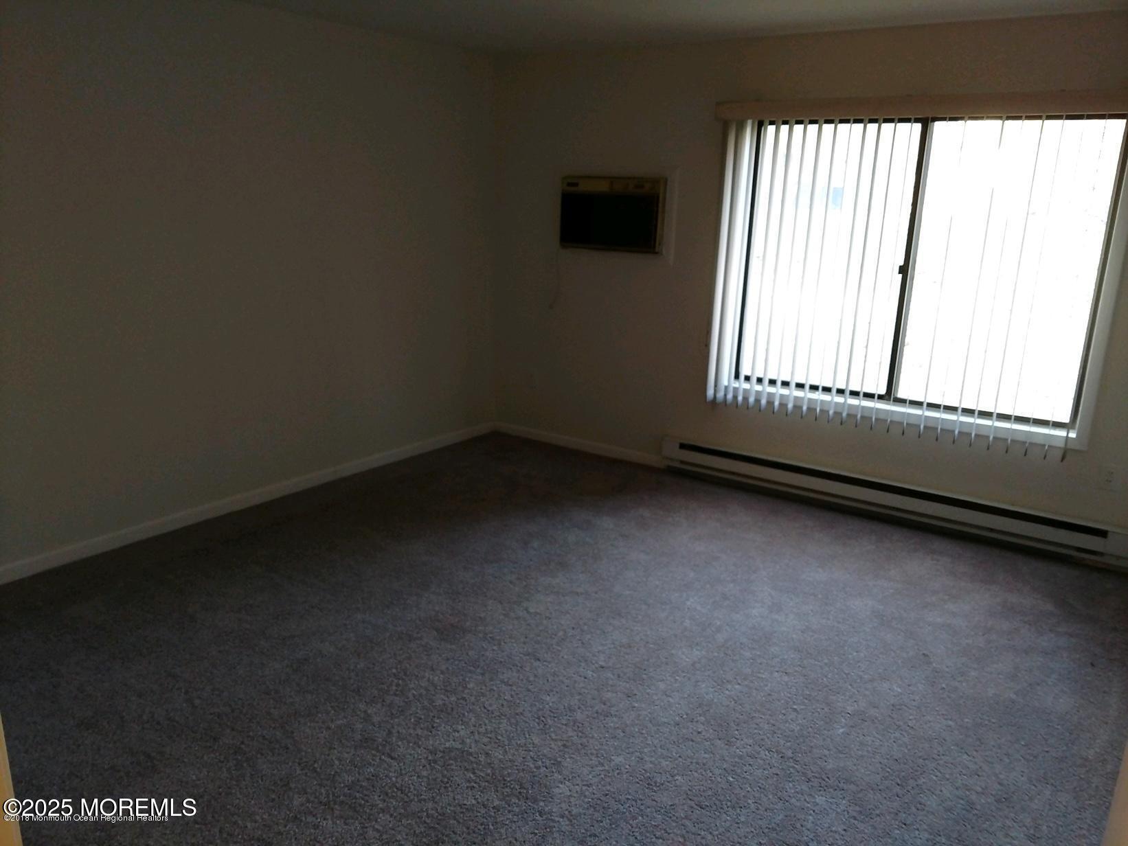 137 Amberly Drive, Unit E Manalapan, NJ 07726 - Photo 21 of 24 a view of a room that has a window in it