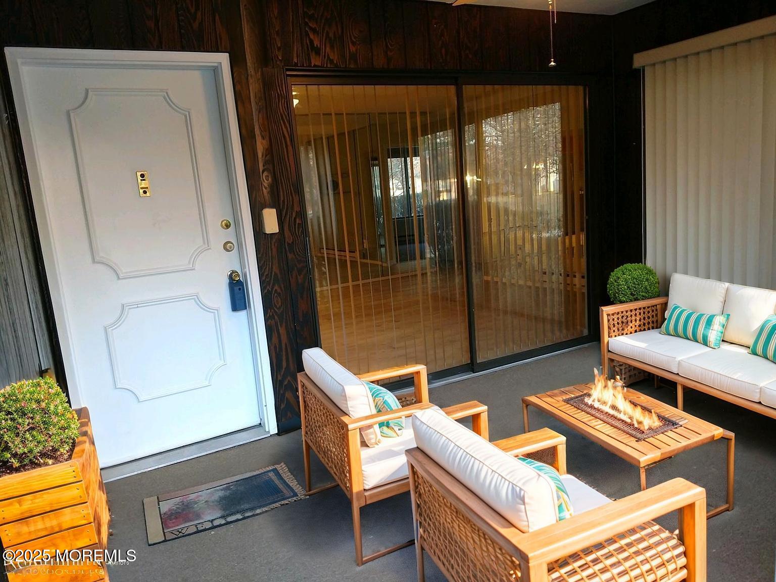 137 Amberly Drive, Unit E Manalapan, NJ 07726 - Photo 3 of 24 a outdoor living space with furniture