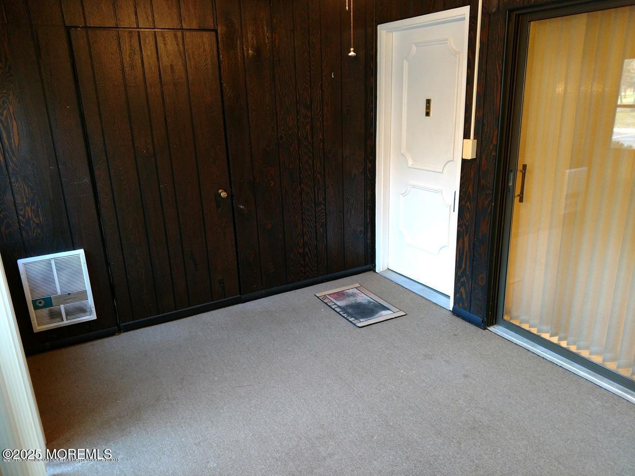137 Amberly Drive, Unit E Manalapan, NJ 07726 - Photo 5 of 24 a view of an empty room and wooden floor