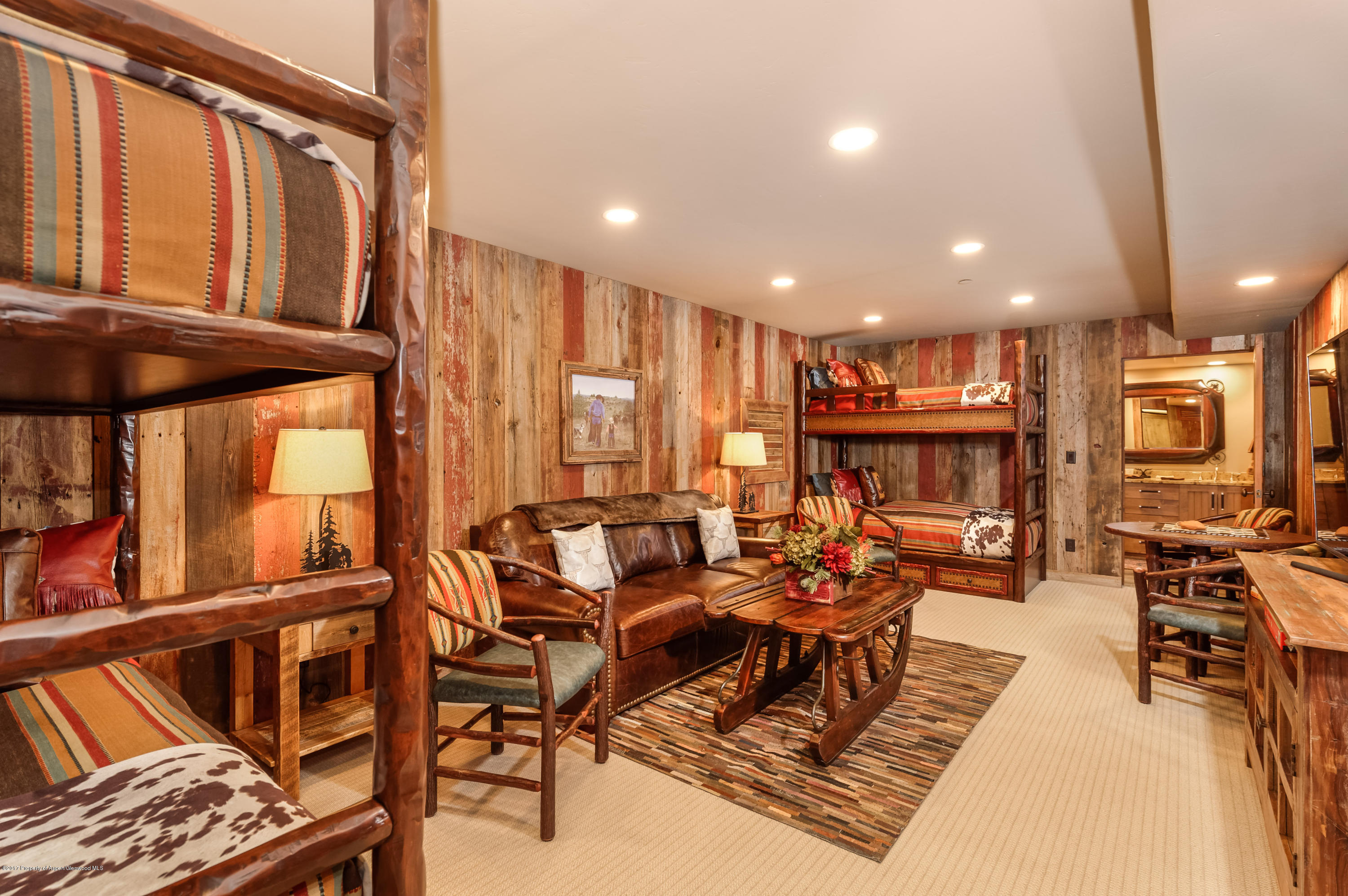 227 Sage Rim Circle Basalt, CO 81621 - Photo 15 of 42 a living room with fireplace furniture and a large window