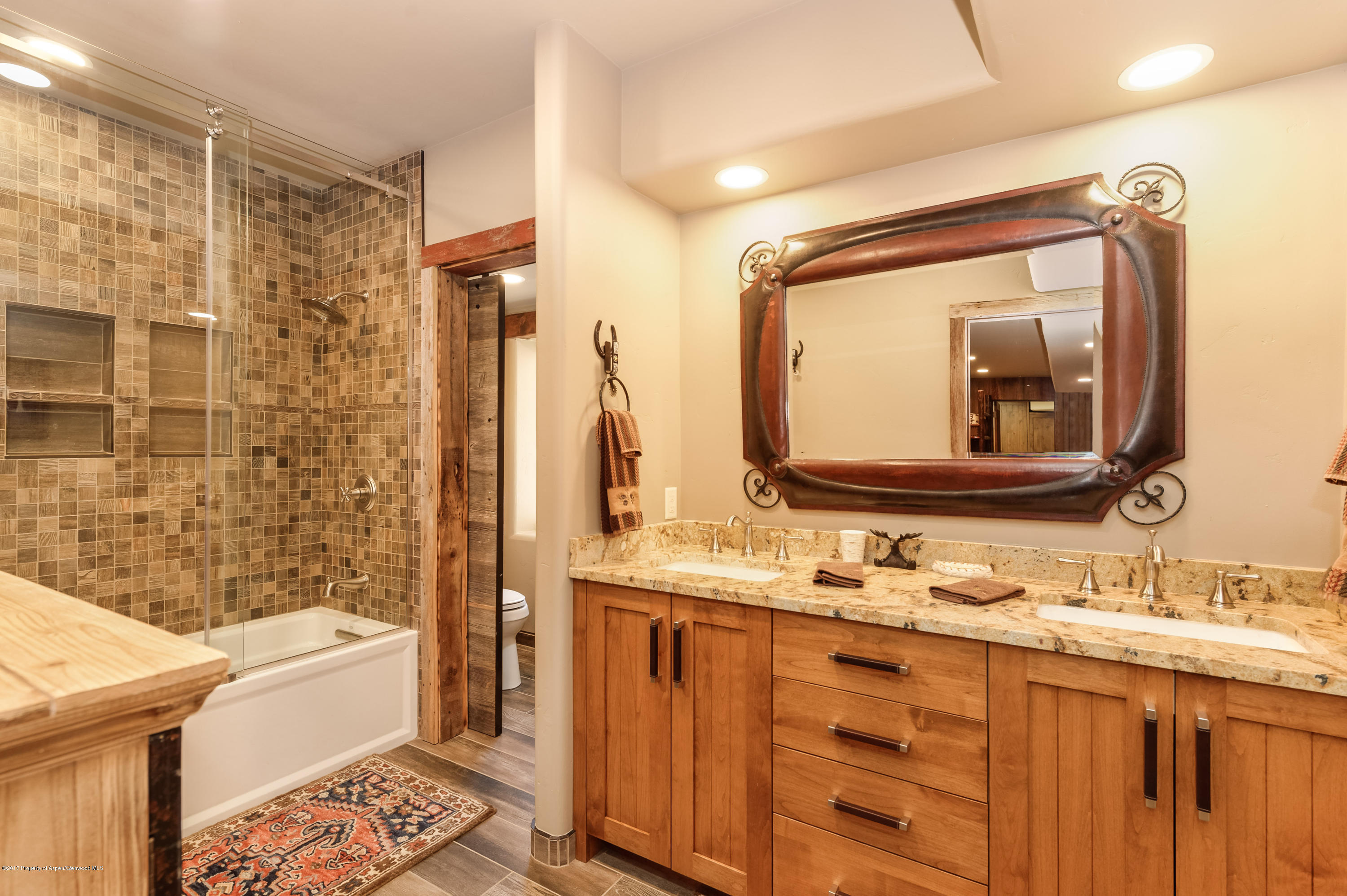 227 Sage Rim Circle Basalt, CO 81621 - Photo 19 of 42 a bathroom with a double vanity sink mirror double and bathtub