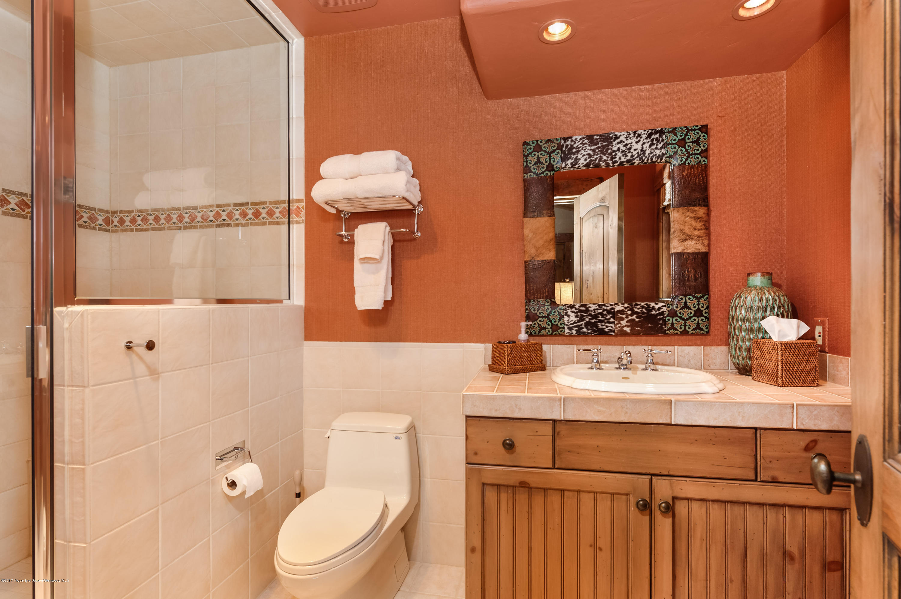 227 Sage Rim Circle Basalt, CO 81621 - Photo 21 of 42 a bathroom with a sink vanity mirror and toilet