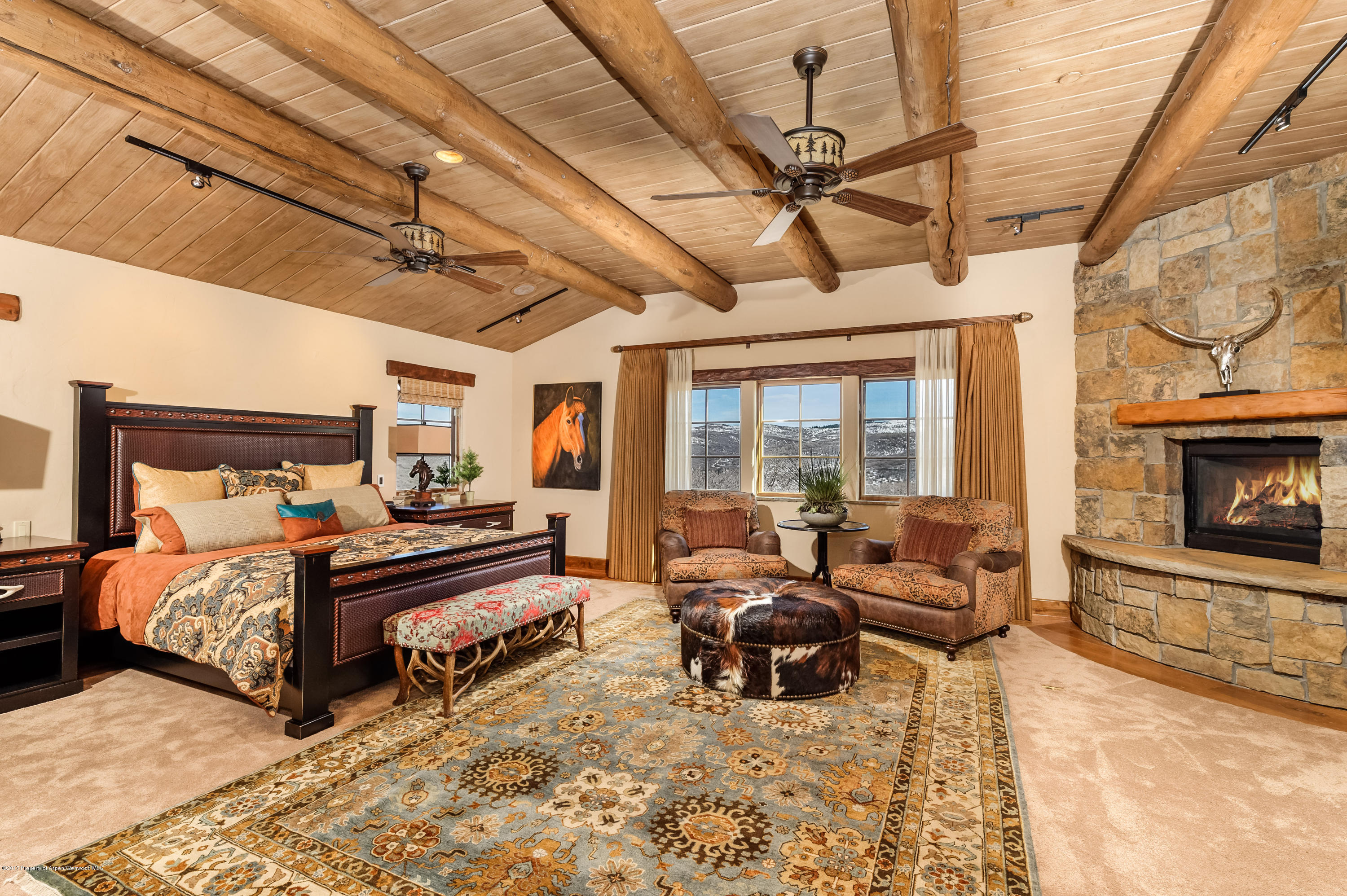 227 Sage Rim Circle Basalt, CO 81621 - Photo 23 of 42 a living room with furniture and a fireplace