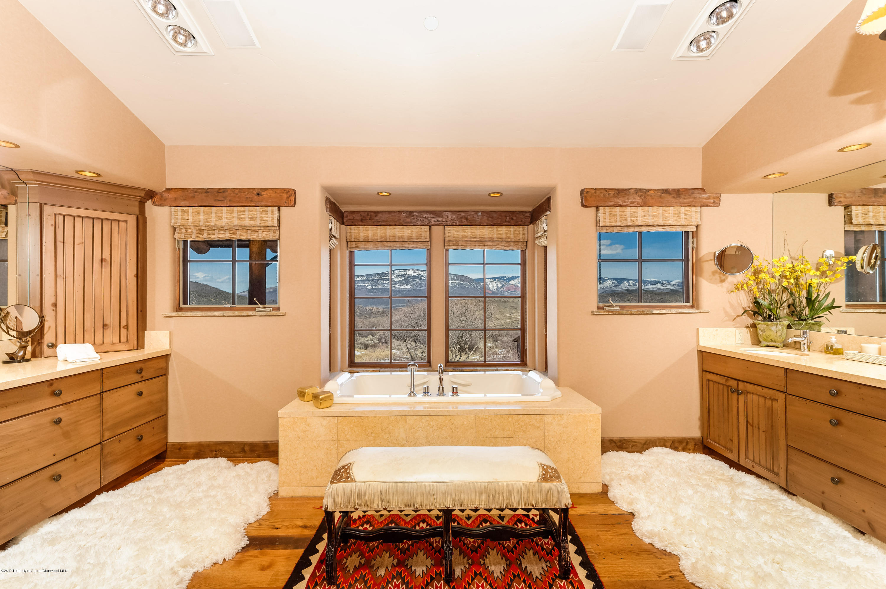 227 Sage Rim Circle Basalt, CO 81621 - Photo 25 of 42 a spacious bedroom with a bed a window and dresser