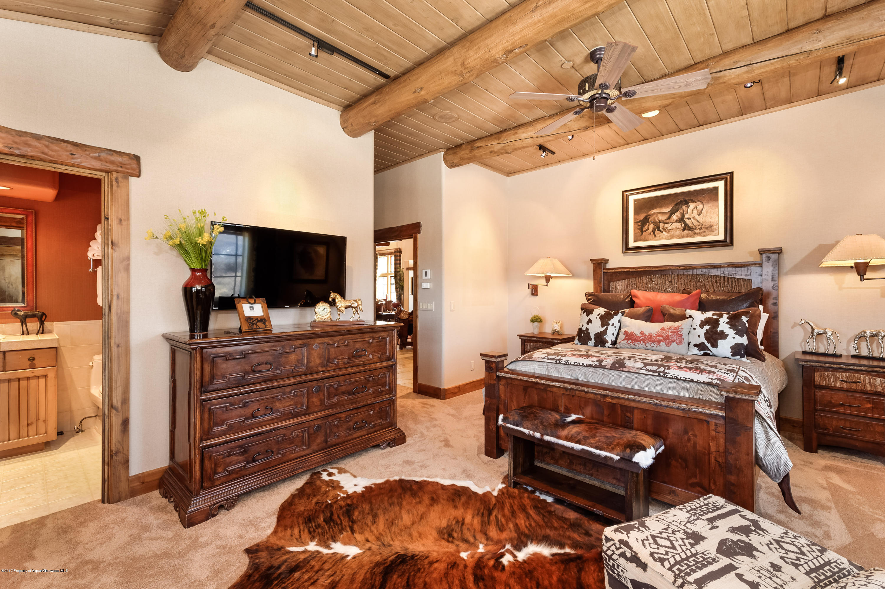 227 Sage Rim Circle Basalt, CO 81621 - Photo 28 of 42 a bed room with furniture and a flat screen tv