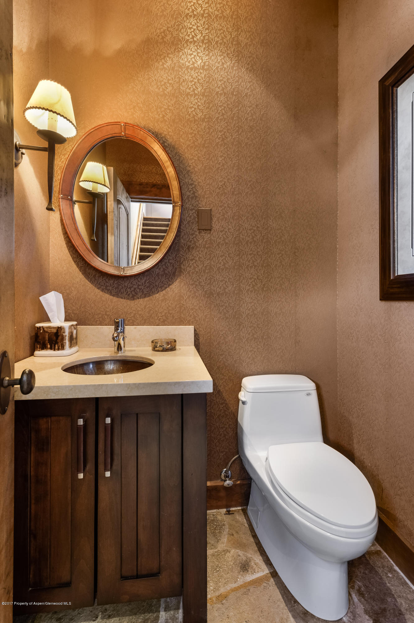 227 Sage Rim Circle Basalt, CO 81621 - Photo 33 of 42 a bathroom with a toilet sink and mirror
