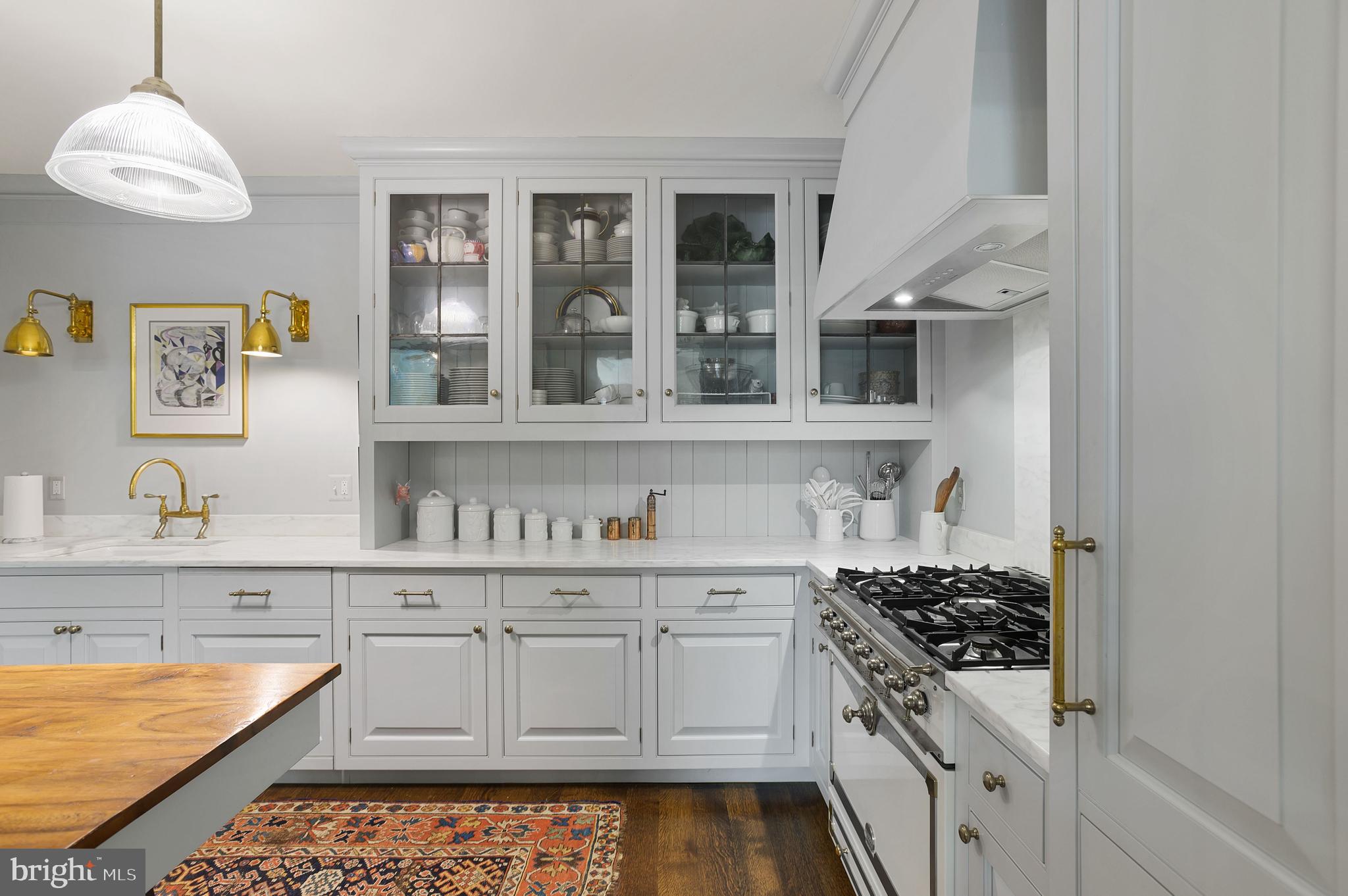 3000 Tilden Street Northwest, Unit ONEI Washington, DC 20008 - Photo 13 of 24 a kitchen with stainless steel appliances a stove a sink and cabinets