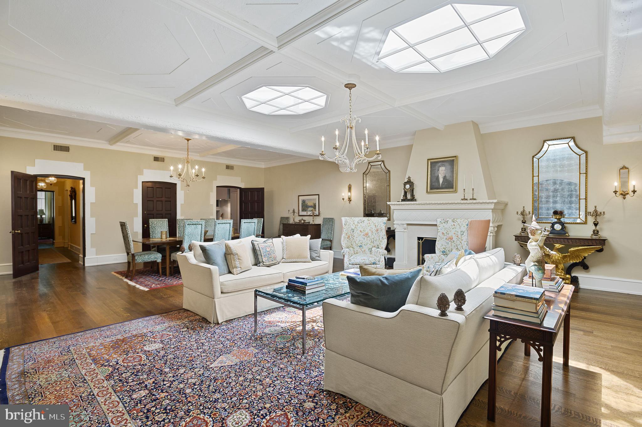 3000 Tilden Street Northwest, Unit ONEI Washington, DC 20008 - Photo 7 of 24 a living room with fireplace furniture and a chandelier