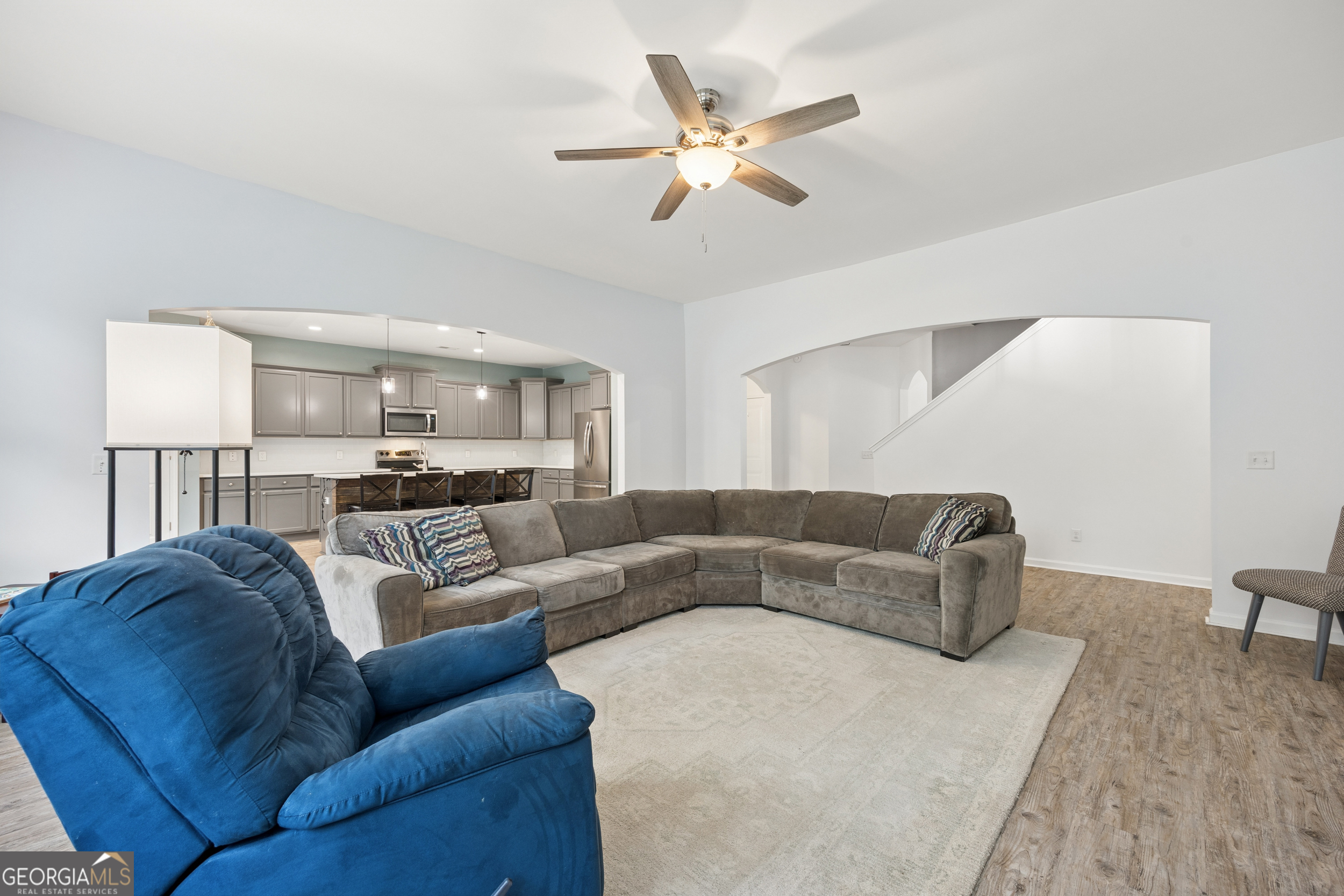 369 Waybridge Way Richmond Hill, GA 31324 - Photo 10 of 40 a living room with furniture and a ceiling fan
