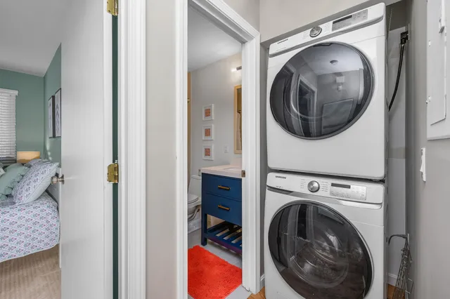 a view of a hallway with washer and dryer