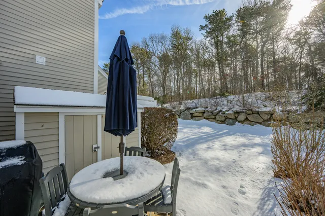 a table and chairs in front of a house