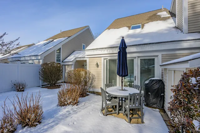 a view of a patio with table and chairs and potted plants