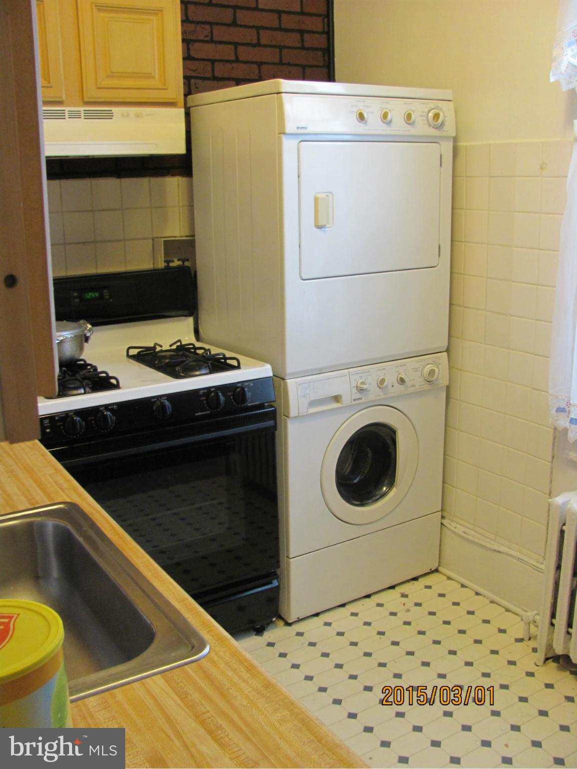 704 Quincy Street Northwest, Unit 202 Washington, DC 20011 - Photo 18 of 24 a utility room with dryer and washer