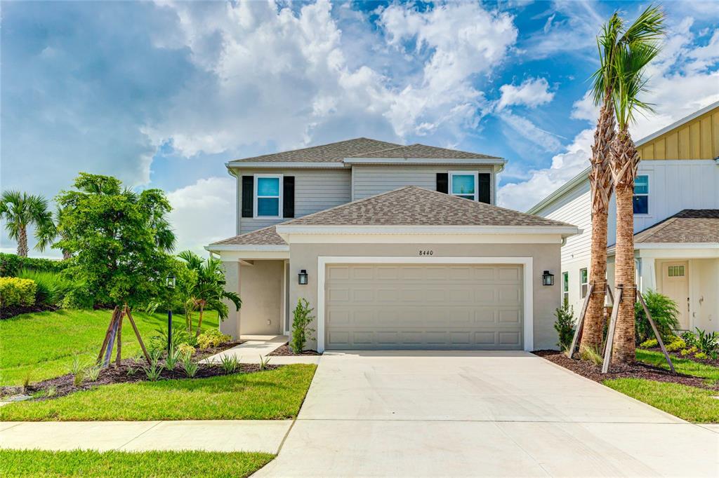 8440 Skye Rnch Boulevard Sarasota, FL 34241 - Photo 1 of 86 a front view of a house with a yard