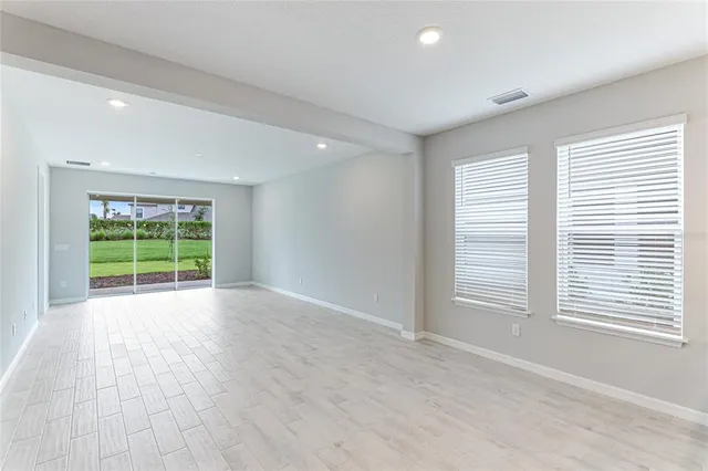 a view of a kitchen with white cabinets and kitchen appliances