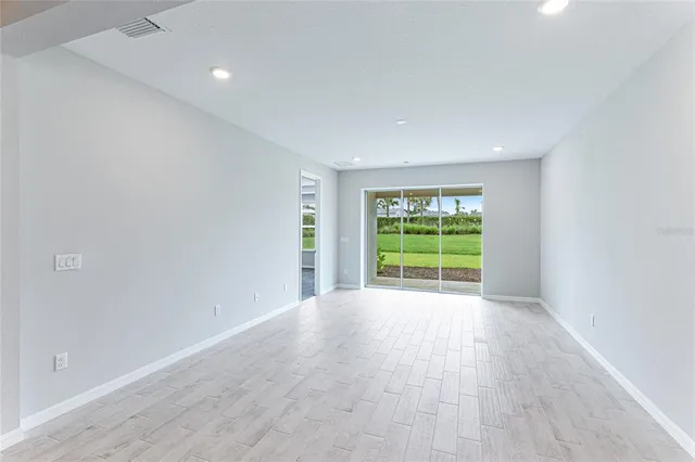 a bathroom with a shower sink and mirror