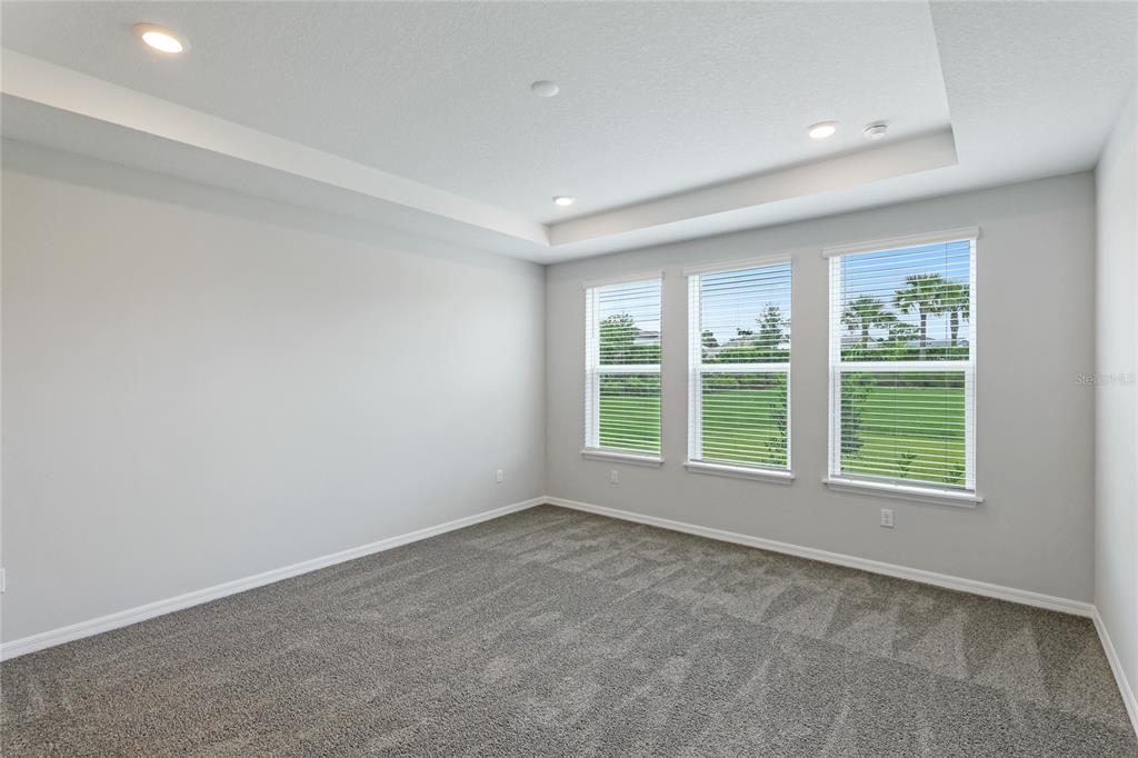 8440 Skye Rnch Boulevard Sarasota, FL 34241 - Photo 18 of 86 an empty room with windows and closet