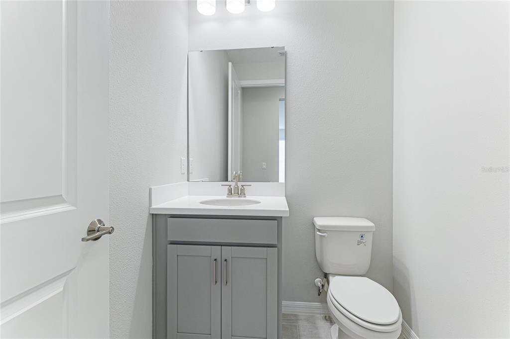 8440 Skye Rnch Boulevard Sarasota, FL 34241 - Photo 24 of 86 a bathroom with a toilet a sink and mirror