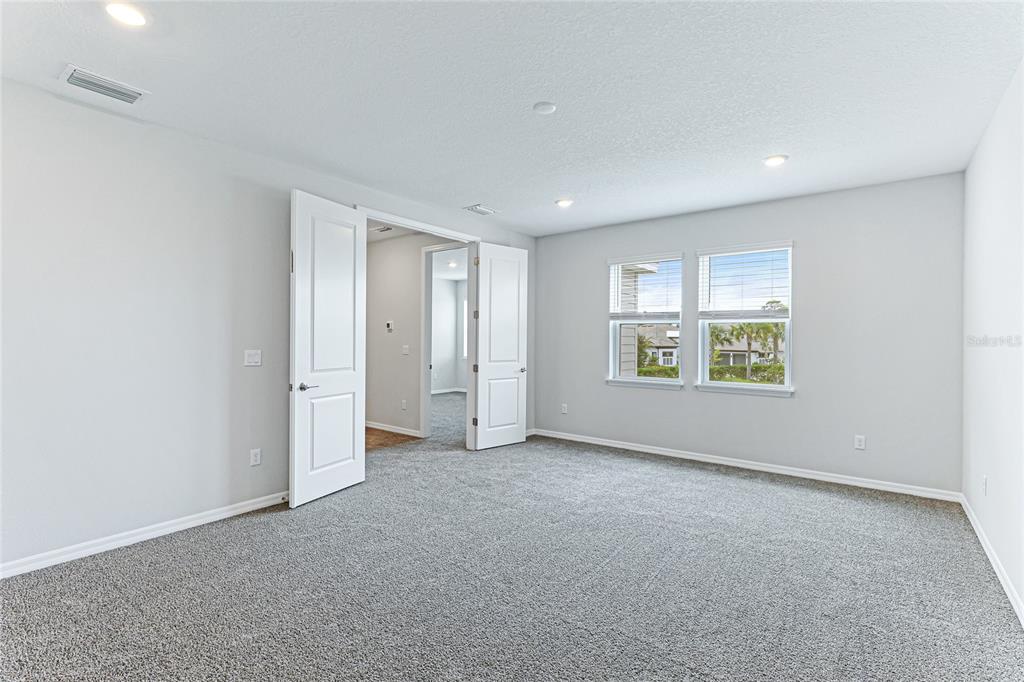 8440 Skye Rnch Boulevard Sarasota, FL 34241 - Photo 26 of 86 an empty room with windows