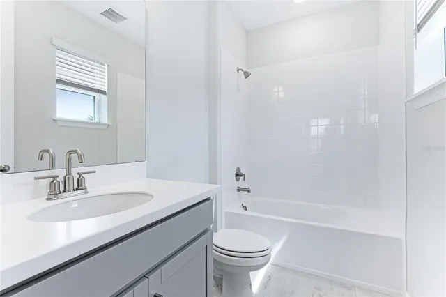 a view of a big room with a big yard and potted plants