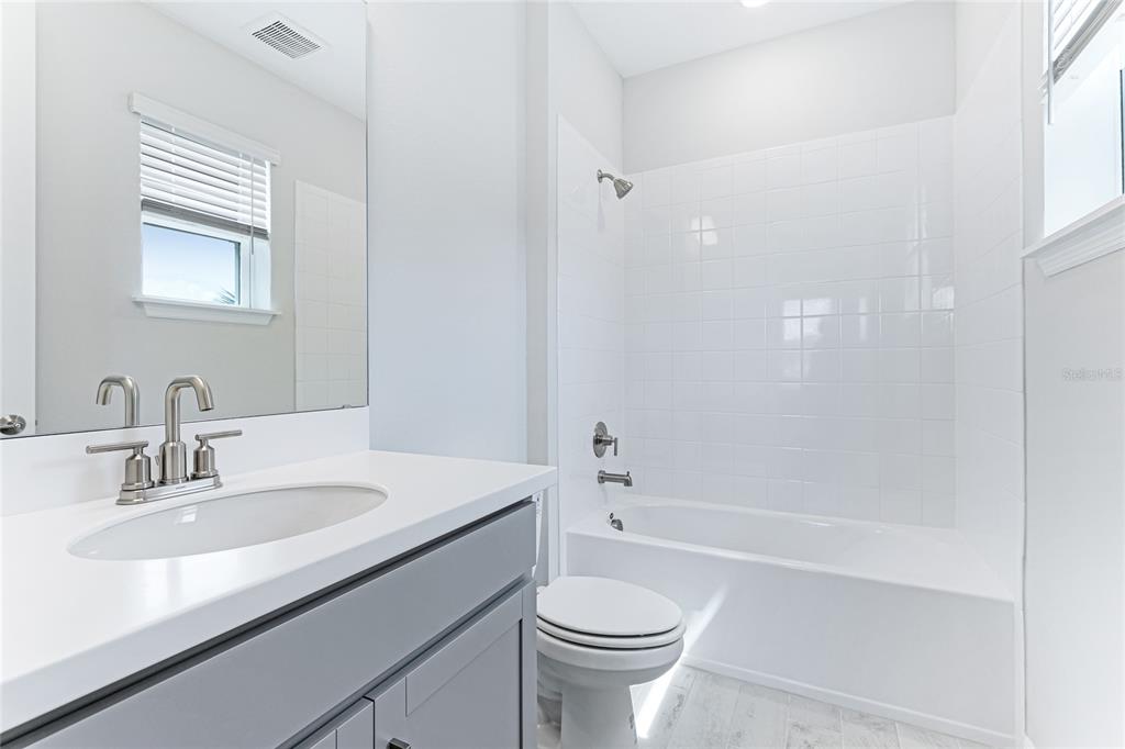 8440 Skye Rnch Boulevard Sarasota, FL 34241 - Photo 31 of 86 a bathroom with a sink a toilet and bathtub