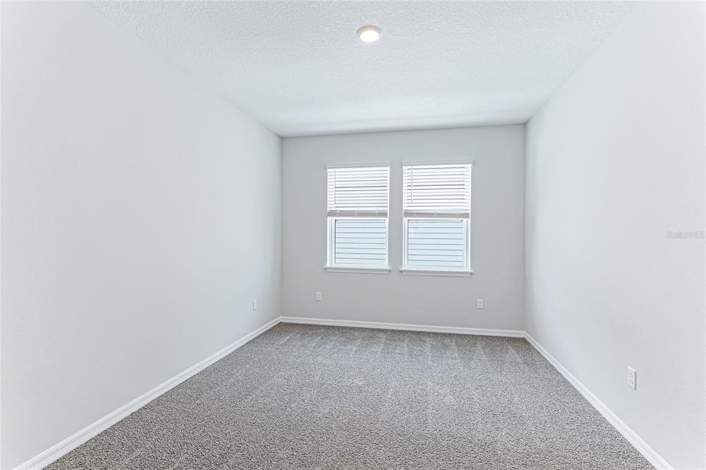 8440 Skye Rnch Boulevard Sarasota, FL 34241 - Photo 32 of 86 an empty room with a window