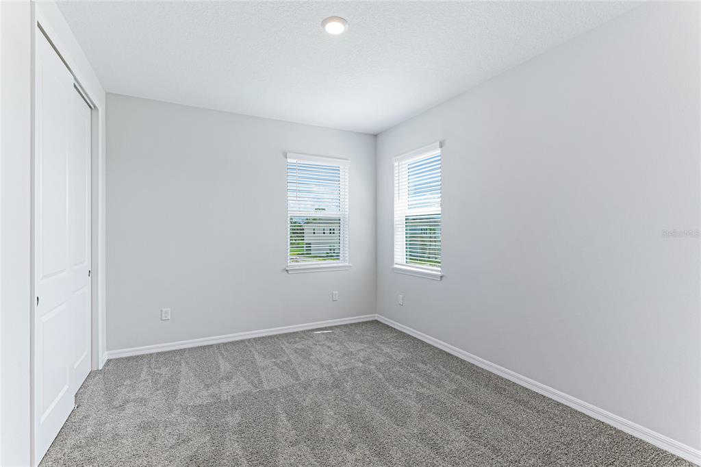 8440 Skye Rnch Boulevard Sarasota, FL 34241 - Photo 34 of 86 an empty room with windows