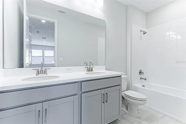 a view of a lake with a table and chairs