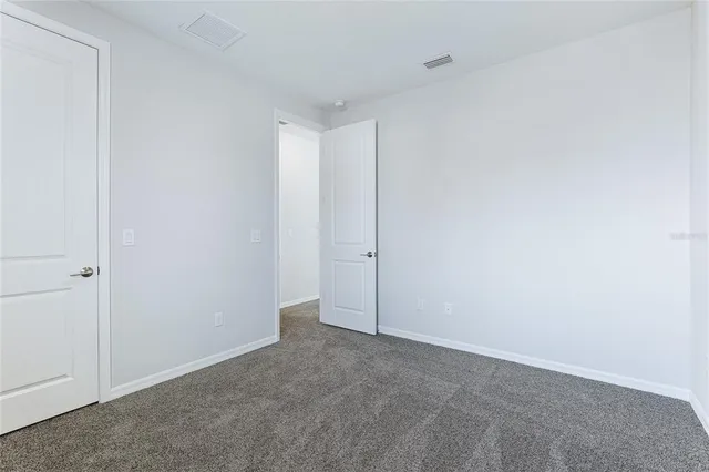 a view of a swimming pool with a garden and plants