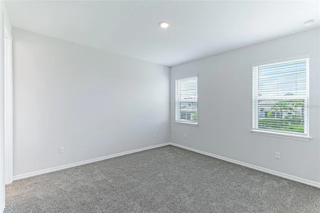 a view of a lake with a table and chairs