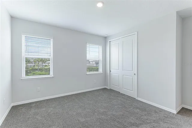 a view of a chairs and table in the balcony