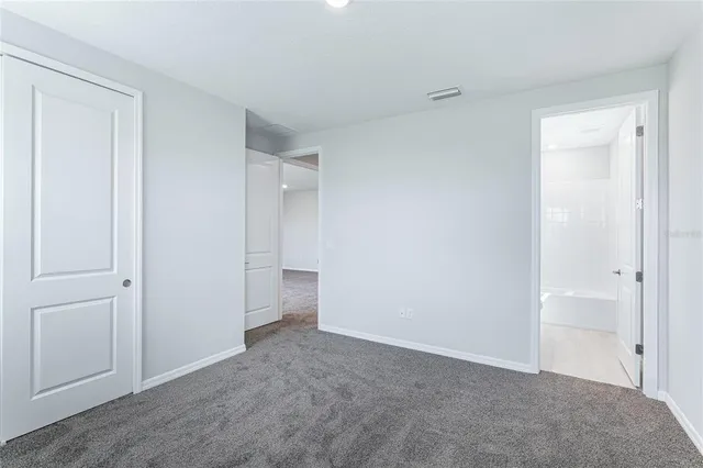 a view of a swimming pool with a patio and a yard