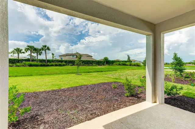 a view of a lake with a big yard