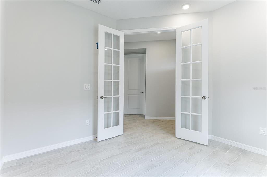 8440 Skye Rnch Boulevard Sarasota, FL 34241 - Photo 7 of 86 an empty room with walk in closet and empty shelves