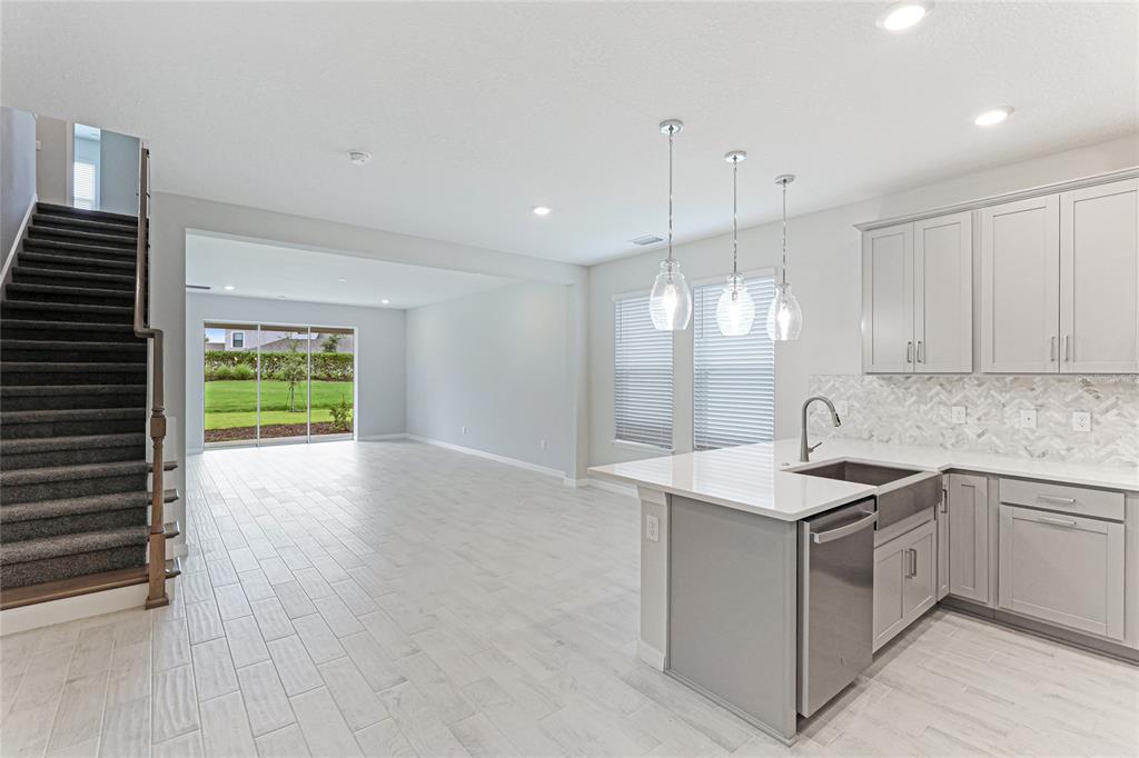 8440 Skye Rnch Boulevard Sarasota, FL 34241 - Photo 8 of 86 a kitchen with a sink stove and cabinets