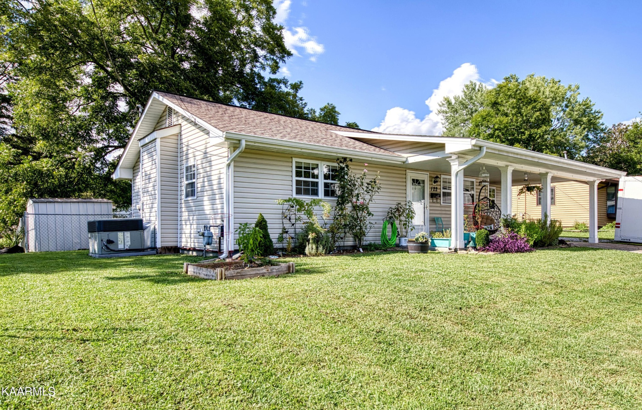 122 Briar Road Oak Ridge, TN 37830 - Photo 25 of 25 a front view of a house with a yard and garage