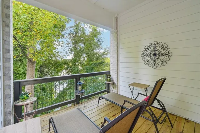 a view of a brick house with a small yard