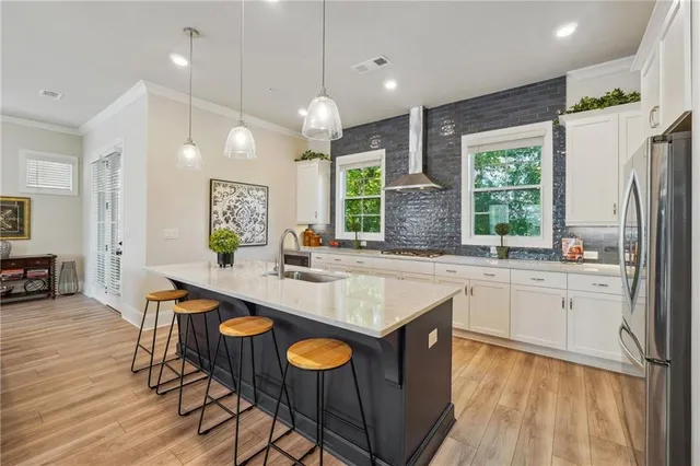 a large kitchen with lots of counter space and a sink