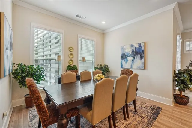 a living room with furniture fireplace and potted plant