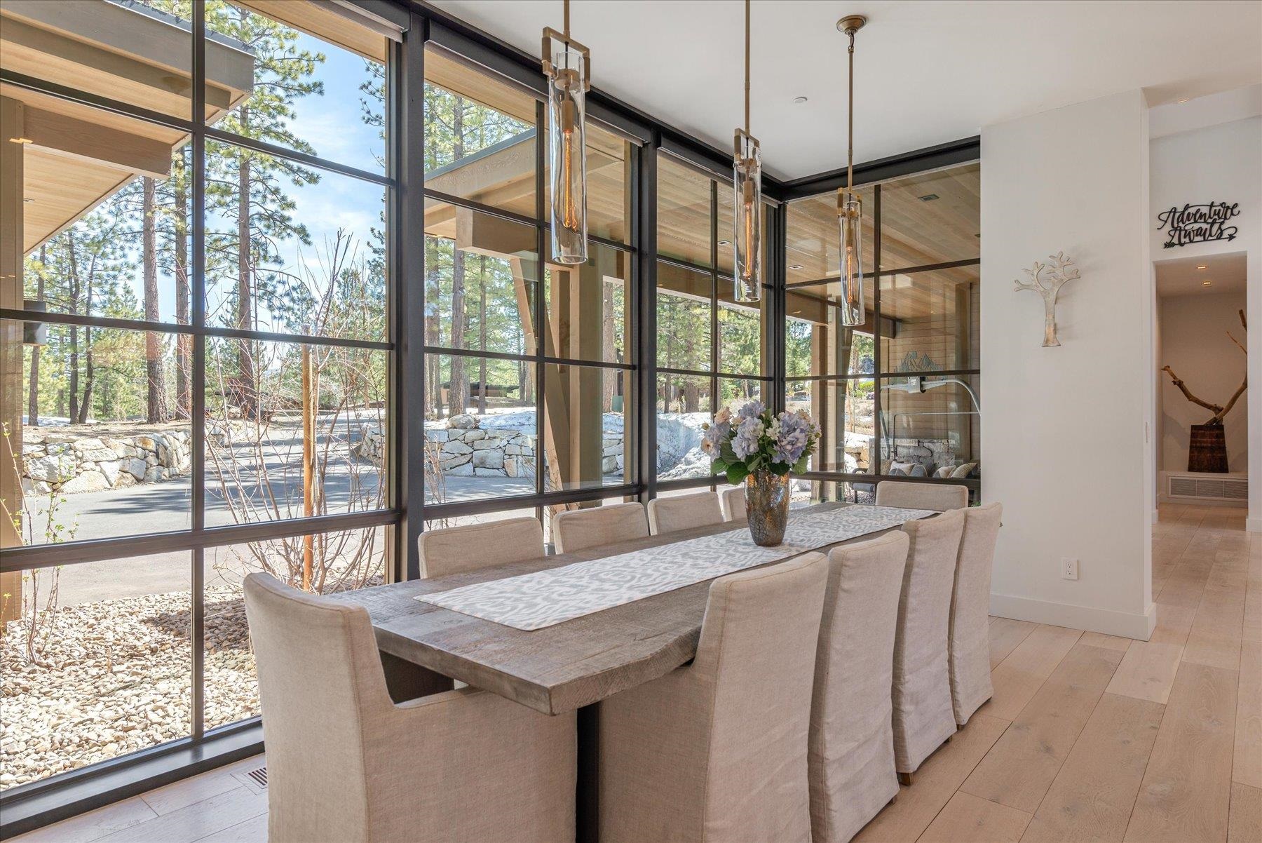 7750 Lahontan Drive Truckee, CA 96161 - Photo 12 of 21 a dining room with furniture a chandelier and wooden floor