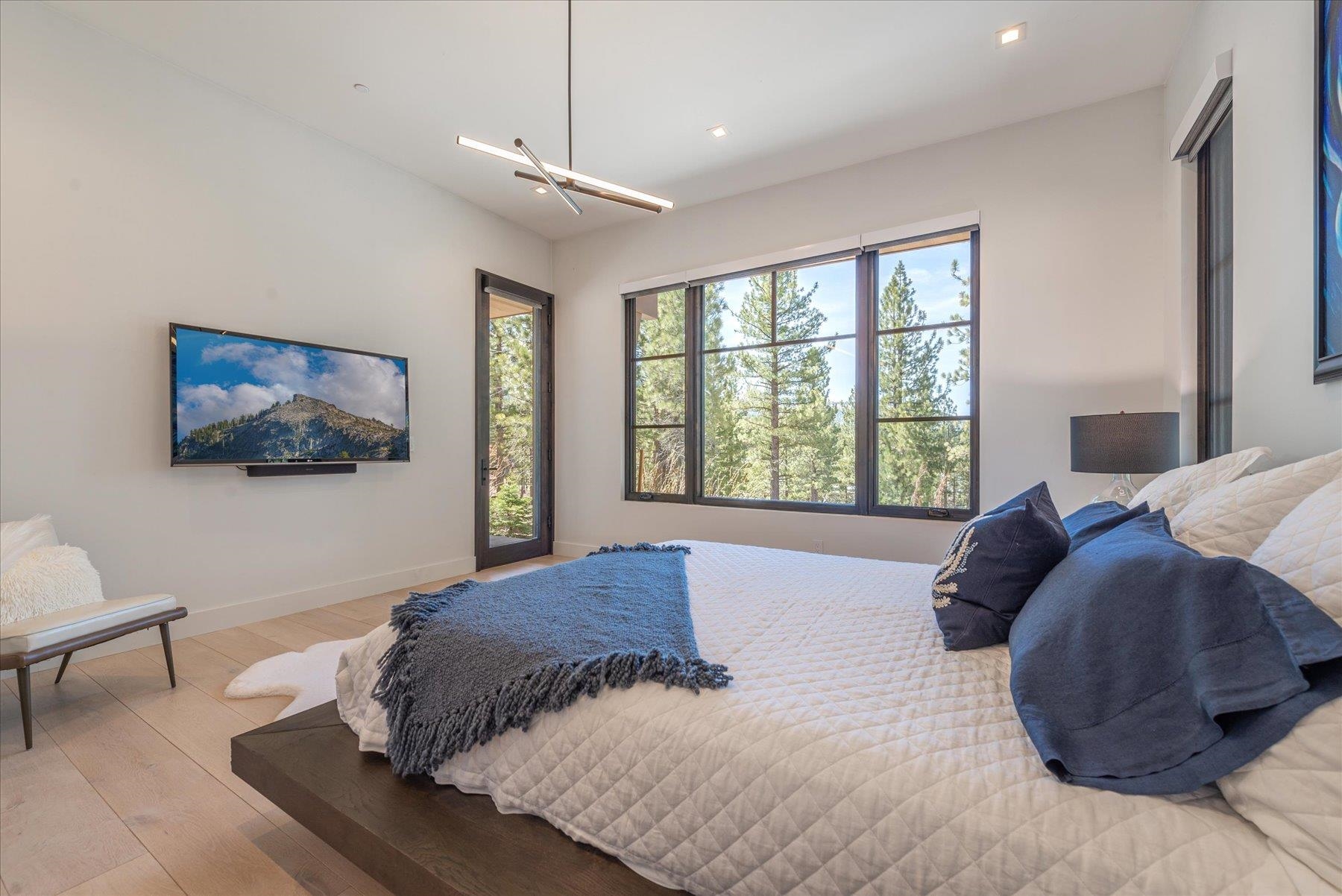 7750 Lahontan Drive Truckee, CA 96161 - Photo 13 of 21 a bed sitting in a bedroom next to a window