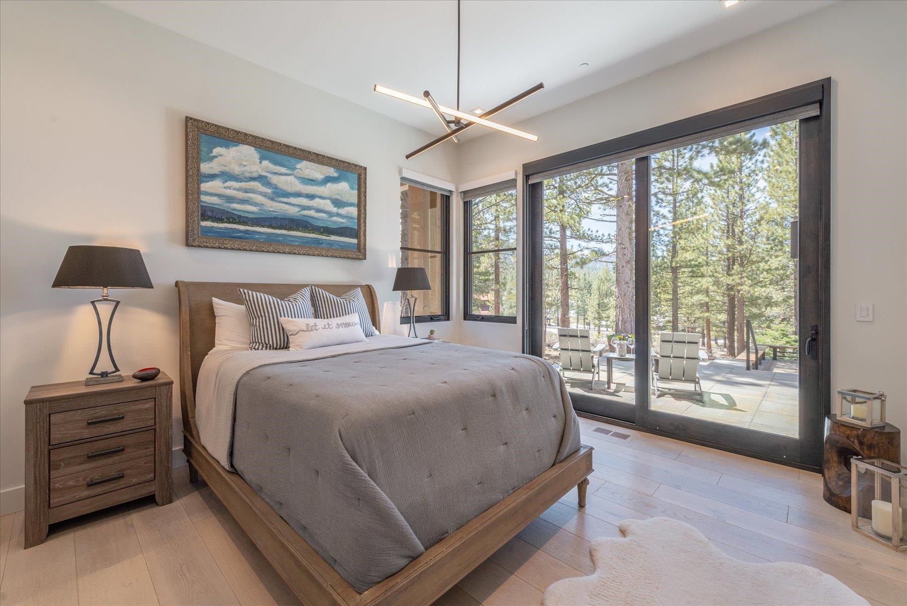 7750 Lahontan Drive Truckee, CA 96161 - Photo 15 of 21 a bedroom with a large bed and a tv