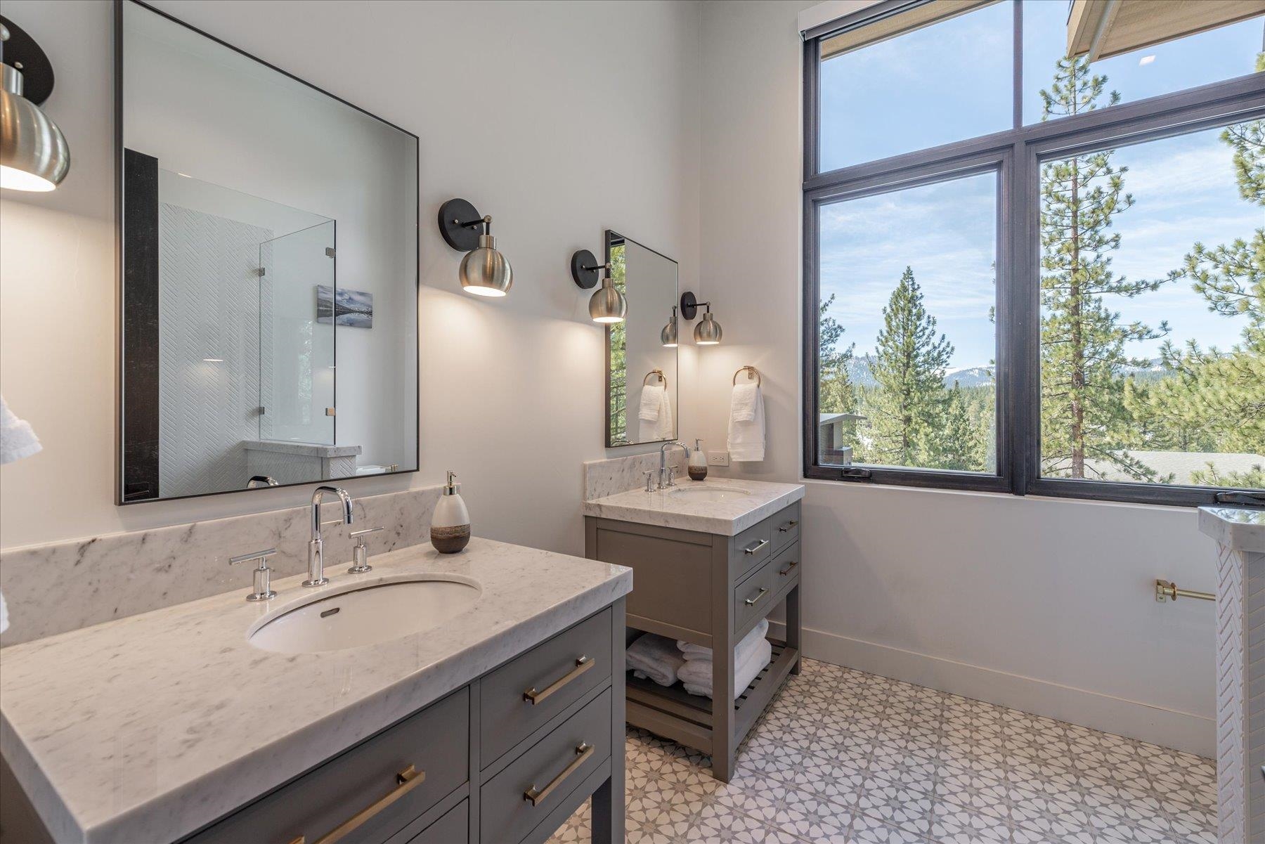 7750 Lahontan Drive Truckee, CA 96161 - Photo 19 of 21 a en suite bathroom with a granite countertop sink and a mirror