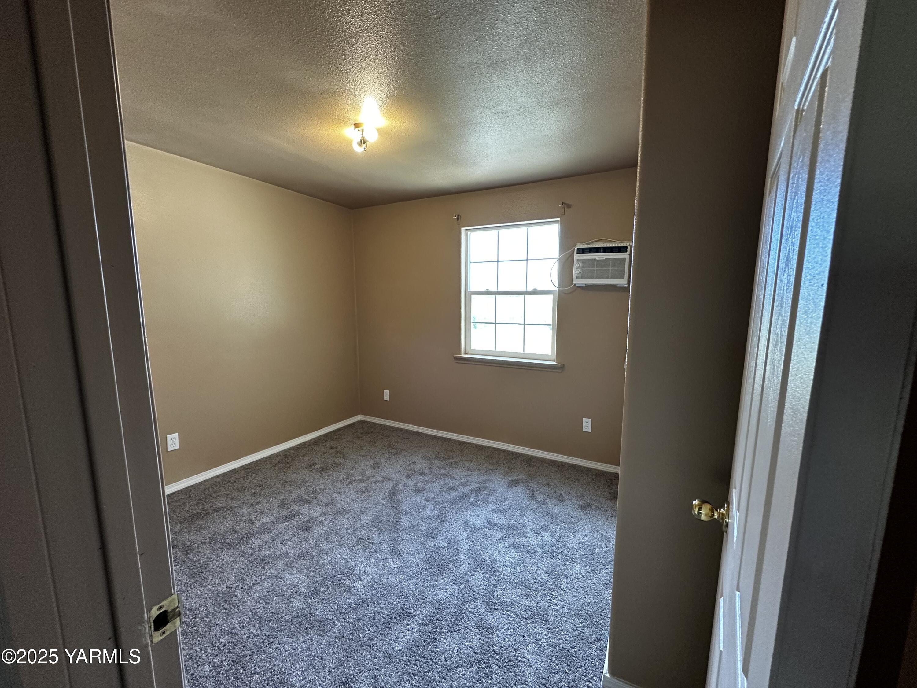 6941 Naches Heights Road Yakima, WA 98908 - Photo 16 of 21 an empty room with windows and closet