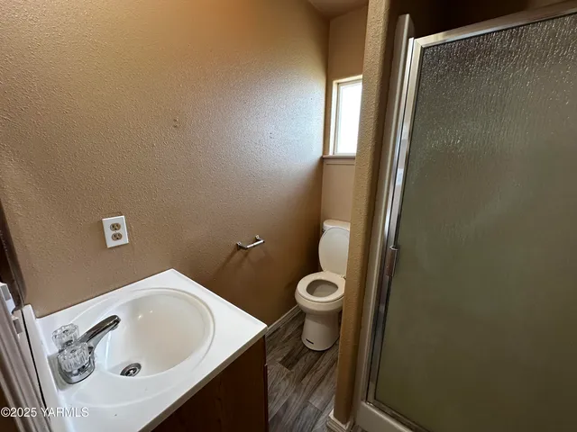a bathroom with a sink and toilet