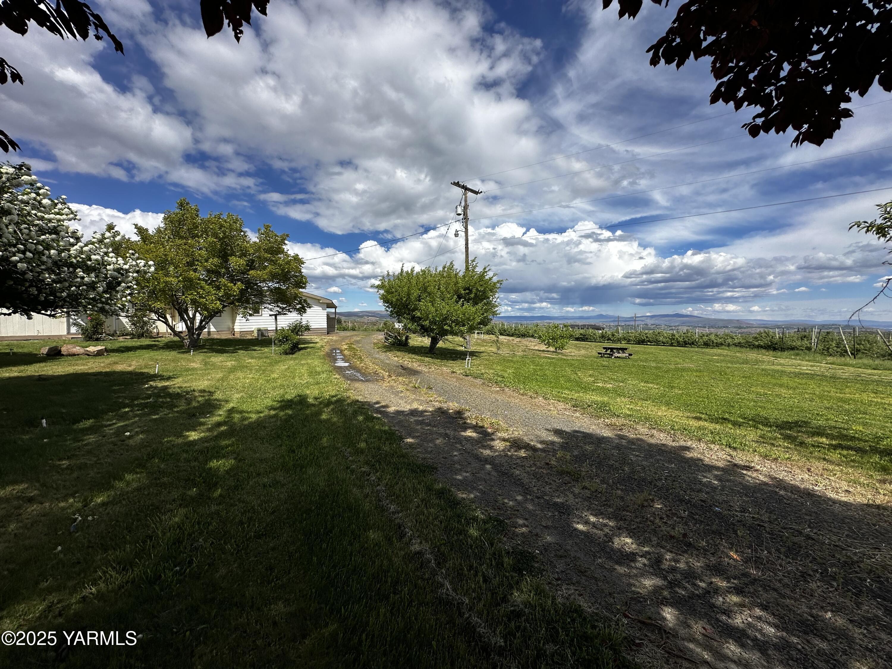 6941 Naches Heights Road Yakima, WA 98908 - Photo 4 of 21 a view of a lake with a building in the background