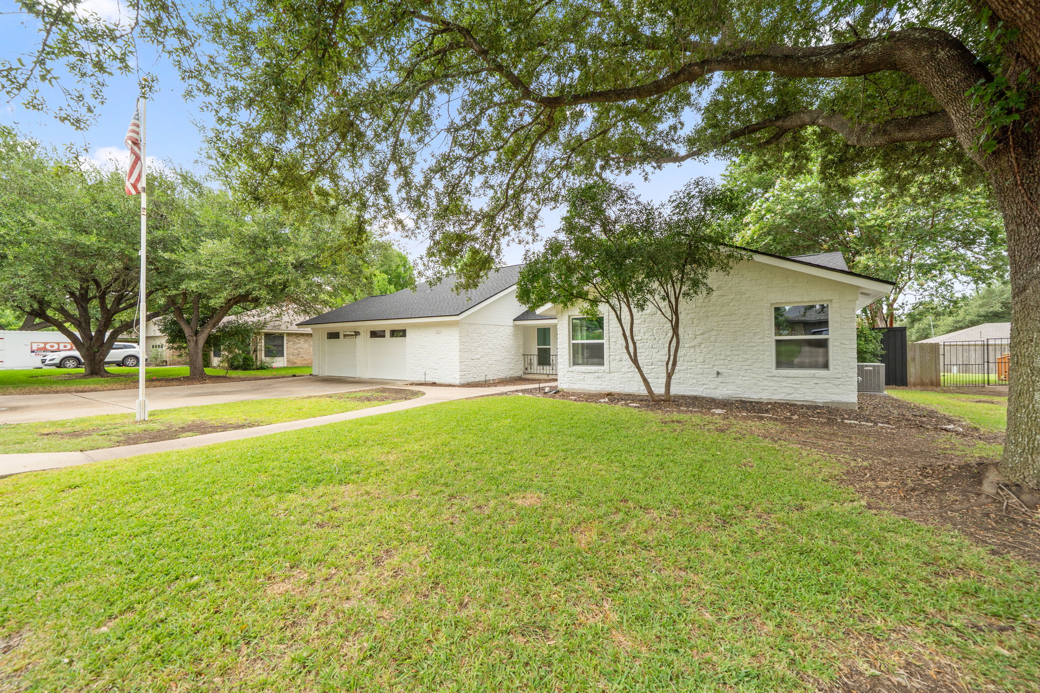 1403 Stone Ridge Drive Taylor, TX 76574 - Photo 3 of 30 a view of a house with backyard and a tree