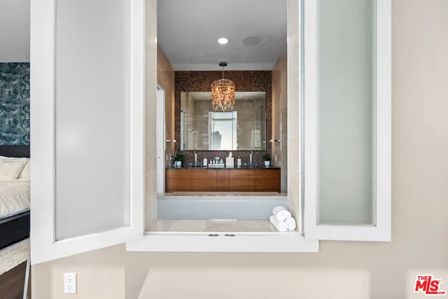 a bathroom with a bathtub and a window