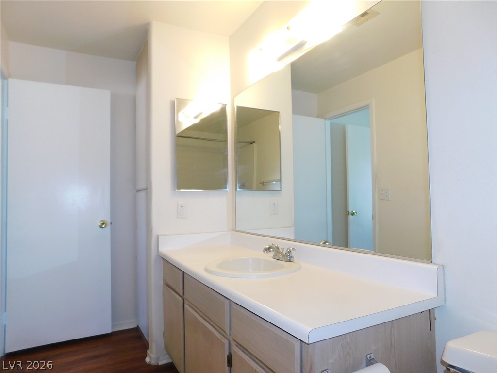 5221 South Lindell Road, Unit 202 Las Vegas, NV 89118 - Photo 19 of 28 A well-lit vanity with a spacious countertop anchors this functional bathroom space.