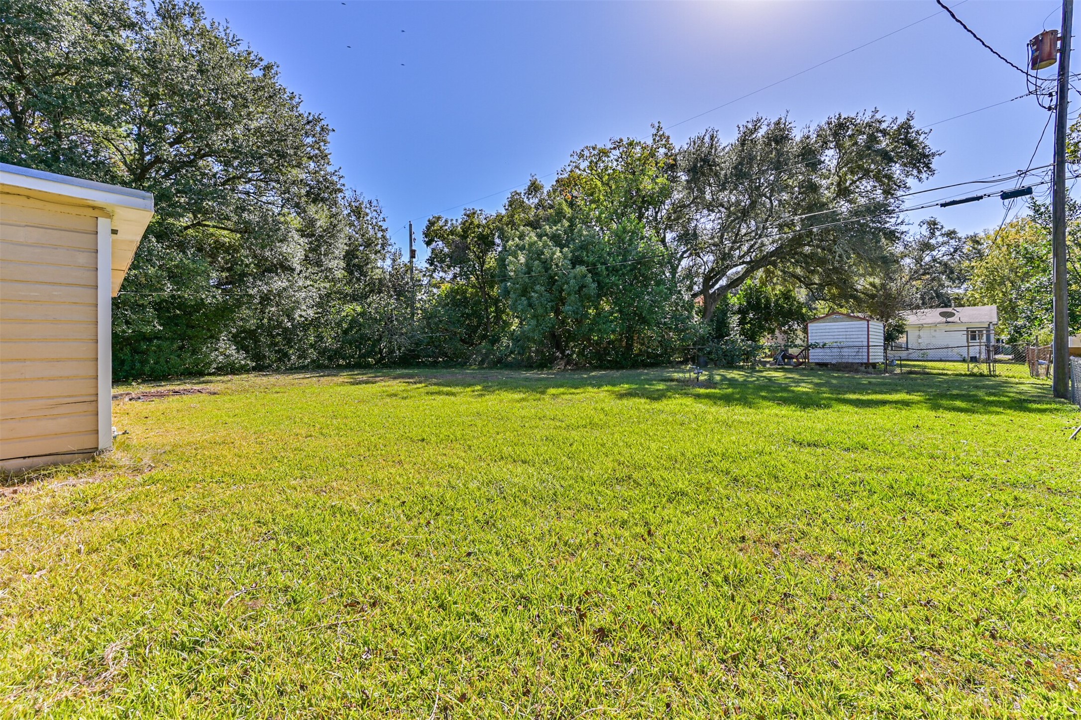 1007 Plum Street La Marque, TX 77568 - Photo 16 of 16 a view of a swimming pool with an outdoor space and seating area